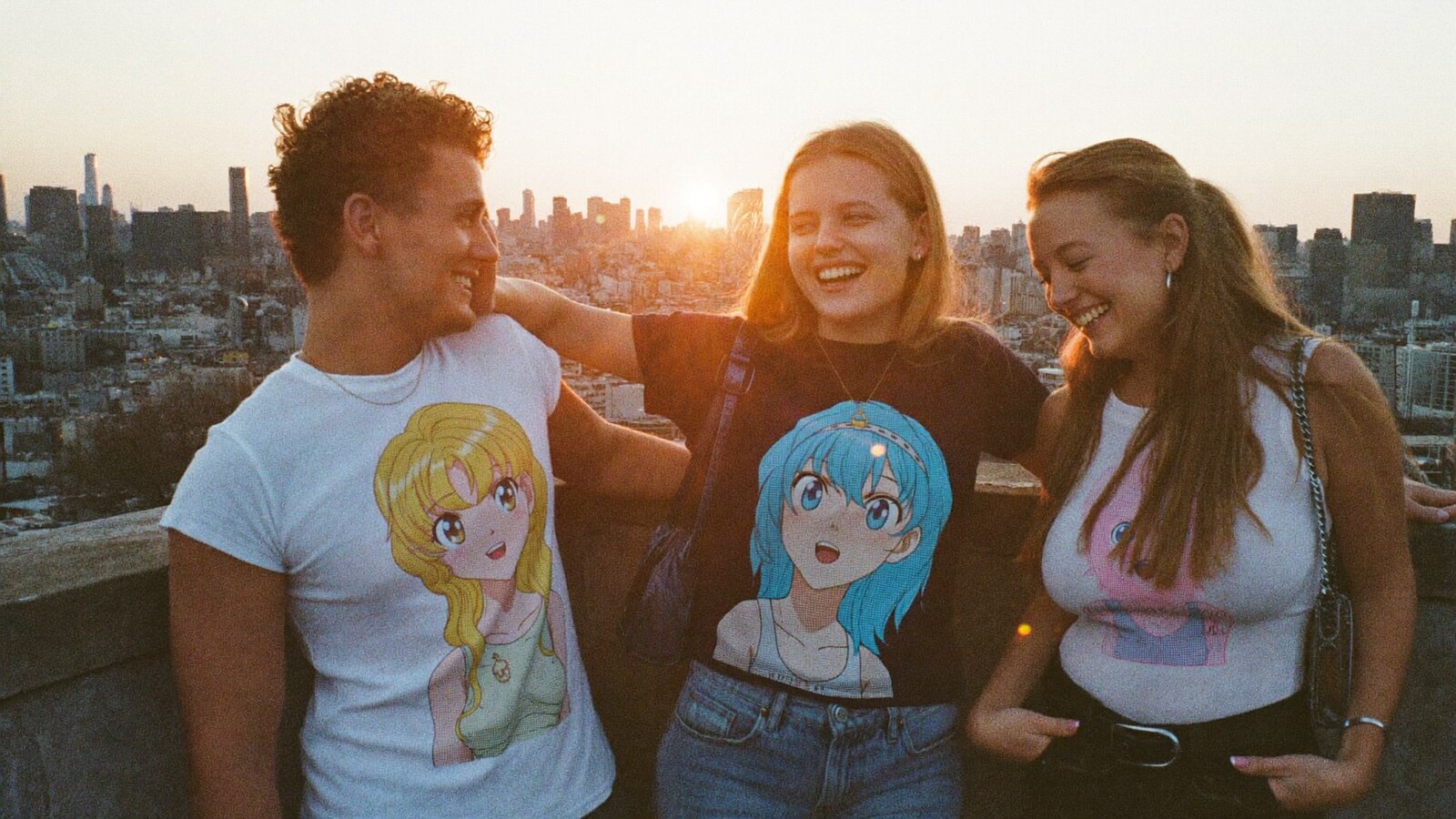 Anime-inspired 2d anime t-shirt in a social or layered scene with friends