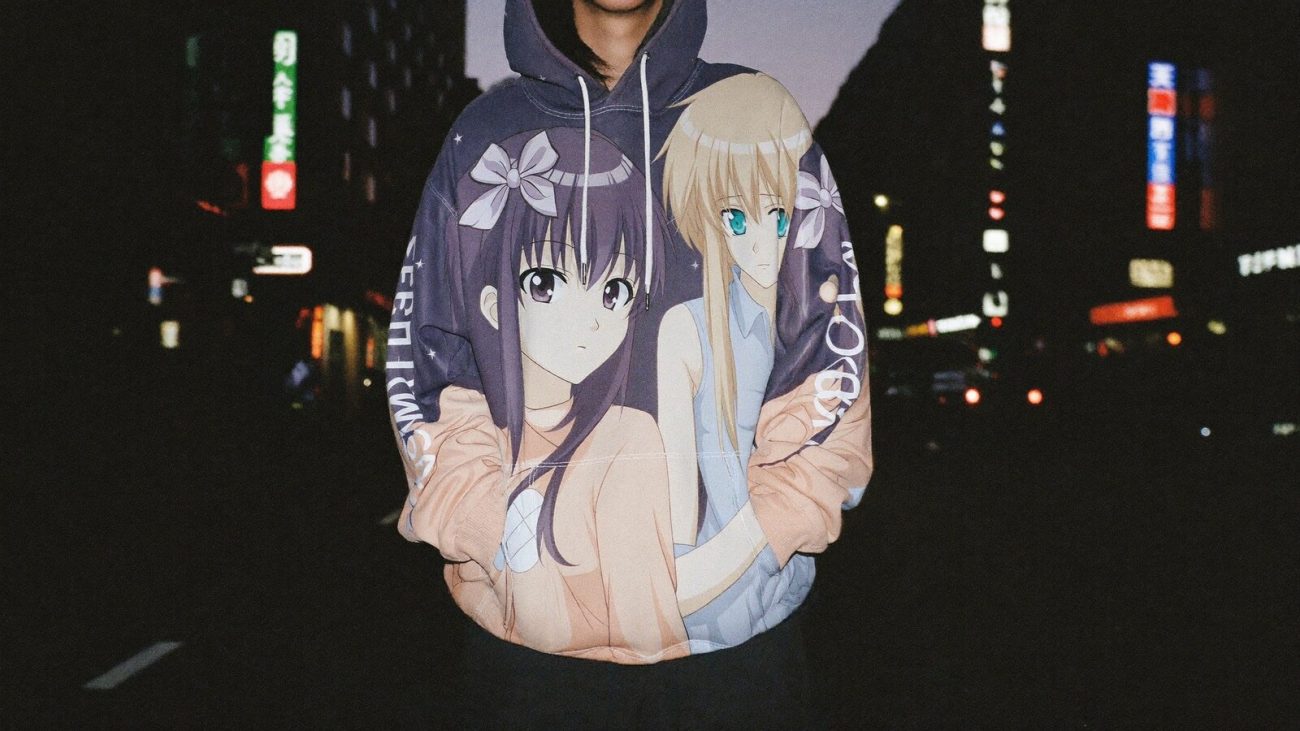 Person wearing an anime-inspired hoodies in an editorial scene
