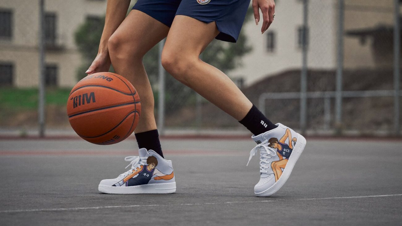 Person wearing an anime-inspired mid 1 basketball shoes in an editorial scene