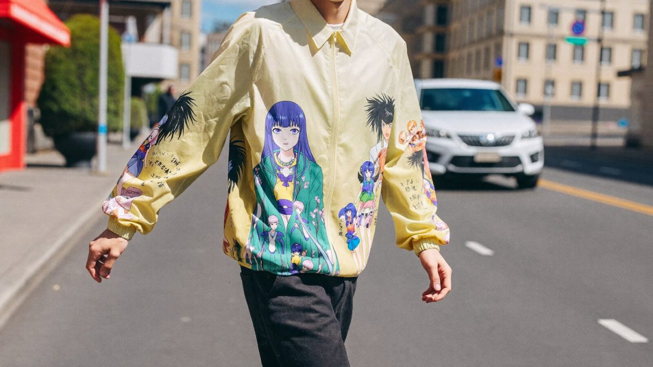 Person wearing an anime-inspired anime windbreaker jackets in an editorial scene