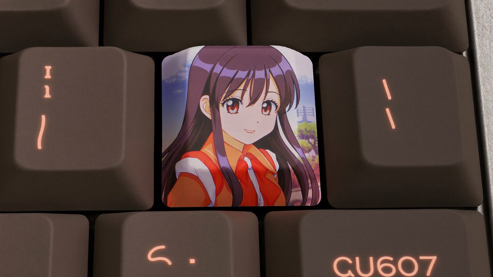 Person wearing an anime-inspired backspace keycap in an editorial scene