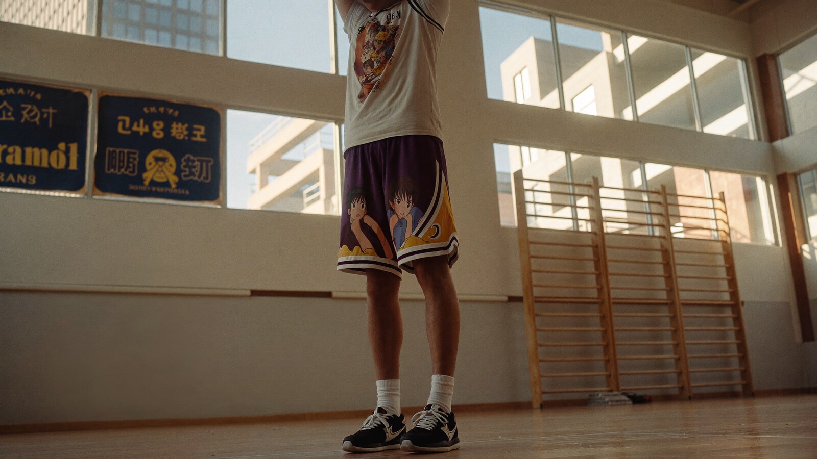 Anime-inspired basketball shorts styled in a natural daylight scene