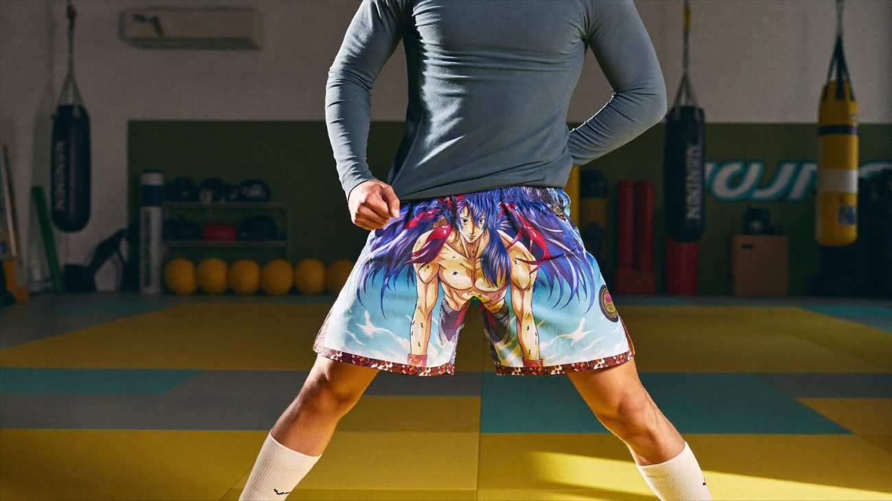Person wearing an anime-inspired bjj & mma fight shorts in an editorial scene