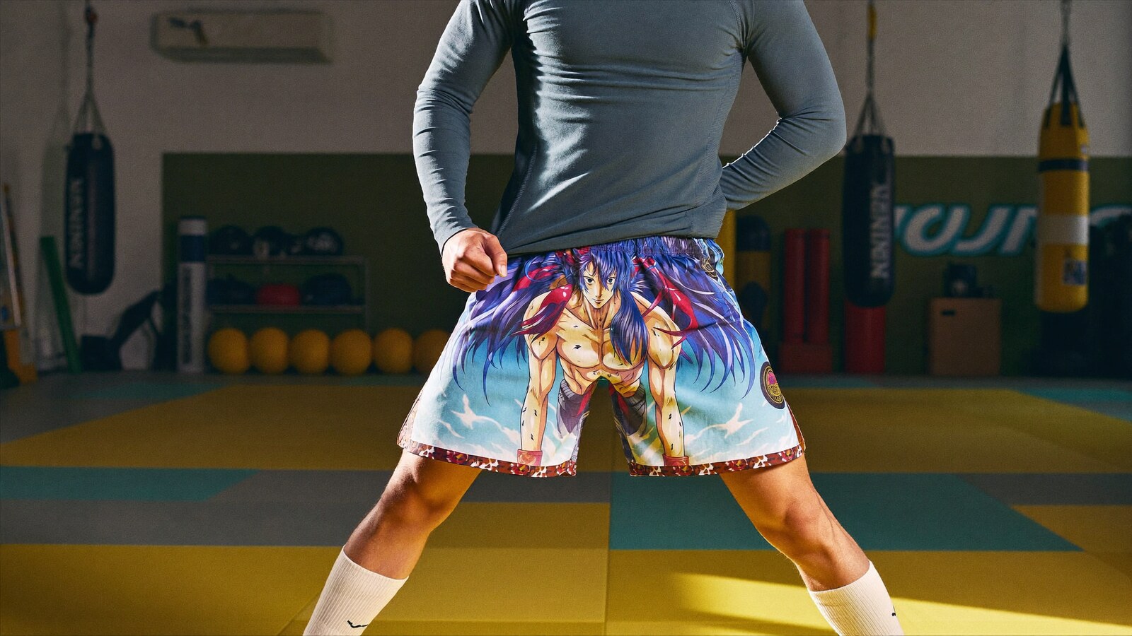 Person wearing an anime-inspired bjj & mma fight shorts in an editorial scene