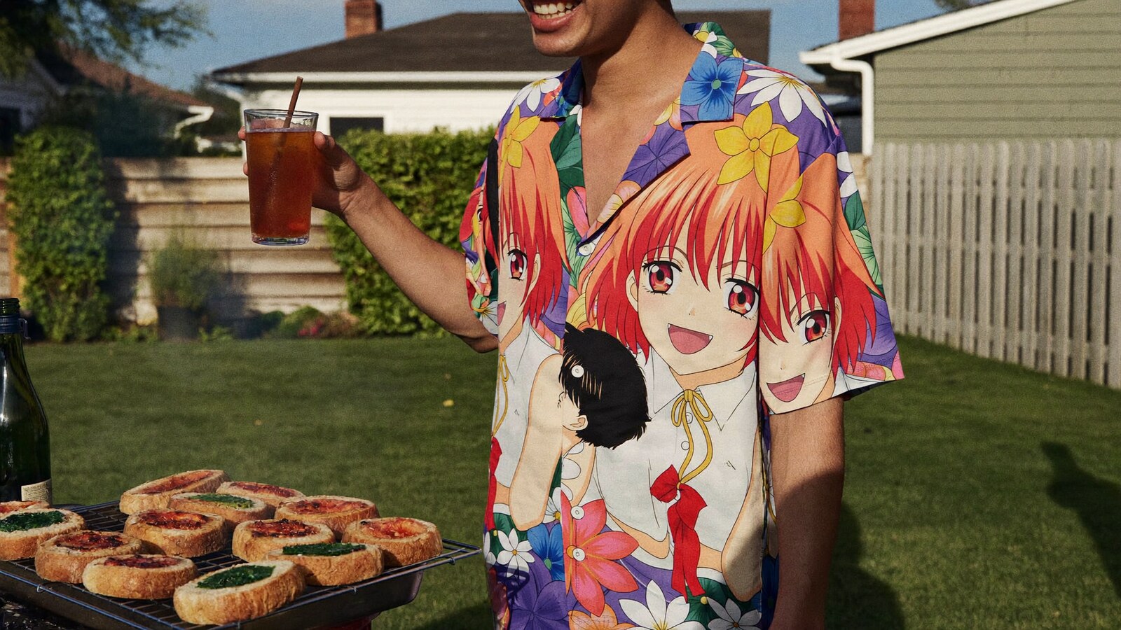 Anime-inspired button up hawaiian shirts styled in a natural daylight scene
