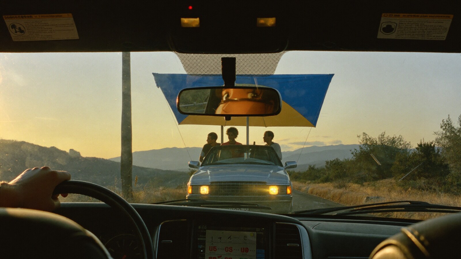 Anime-inspired car auto sunshades in a social or layered scene with friends