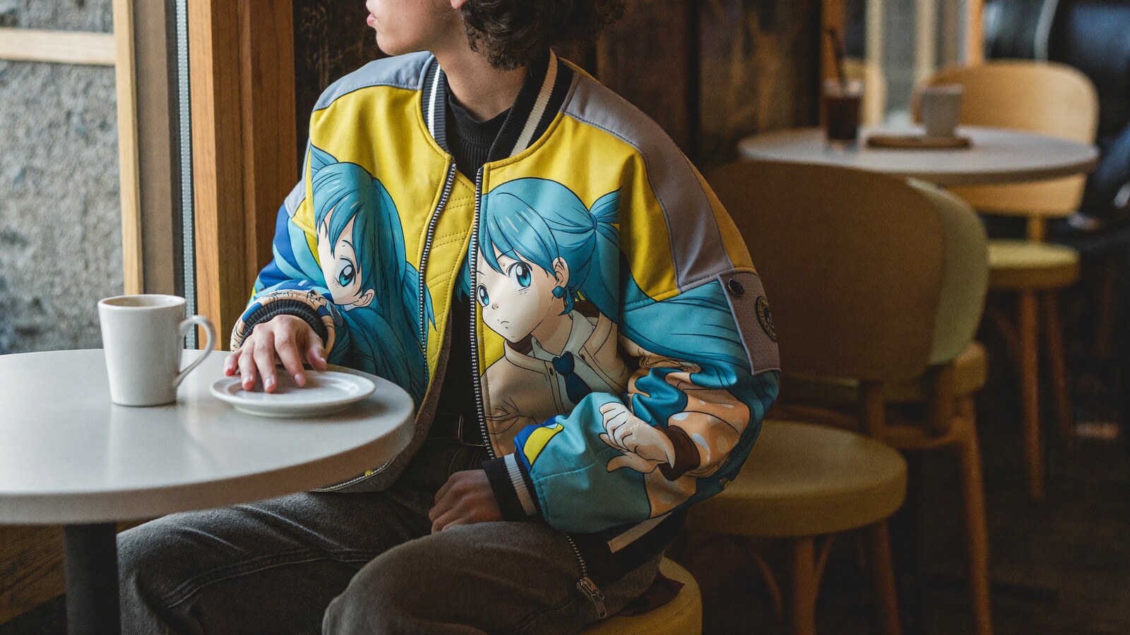 Anime-inspired casual bomber jacket styled in a natural daylight scene