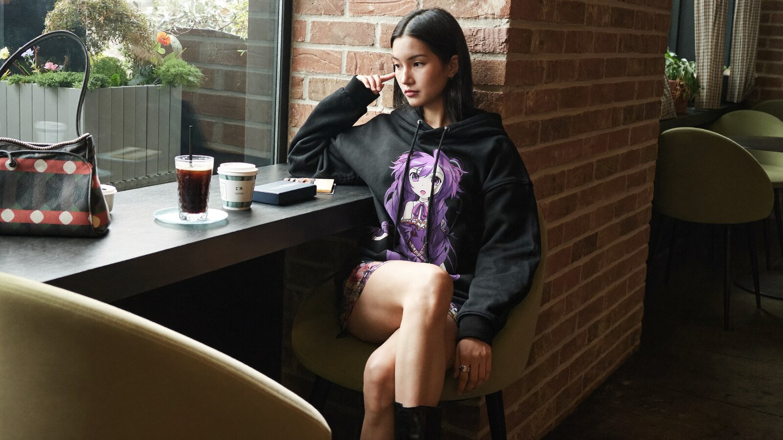 Anime-inspired hoodie dress styled in a natural daylight scene