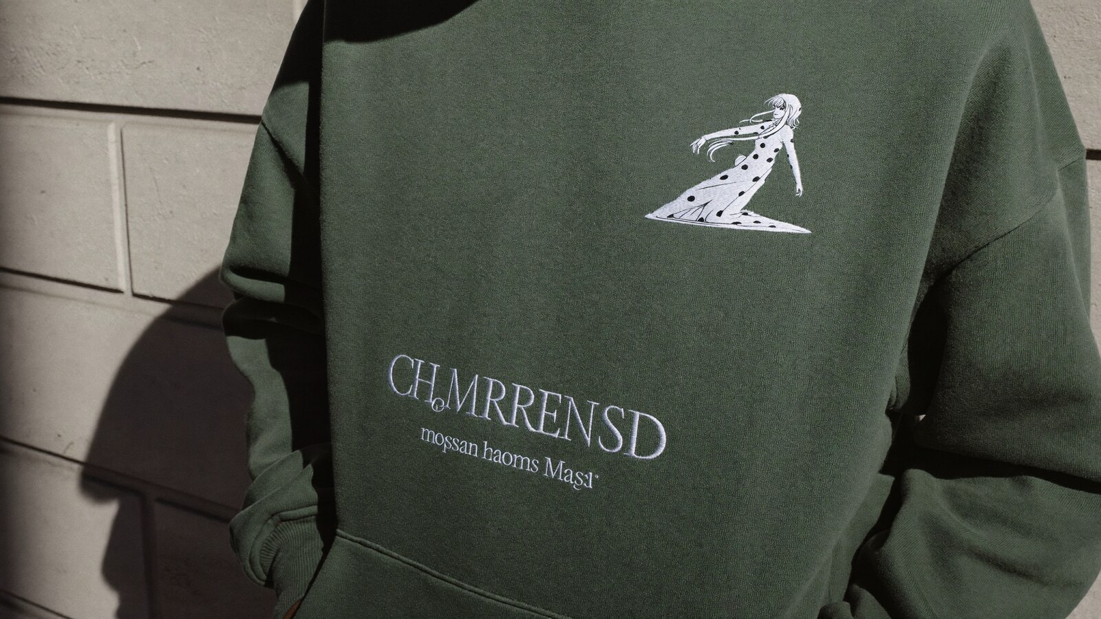 Person wearing an anime-inspired custom embroidered in an editorial scene
