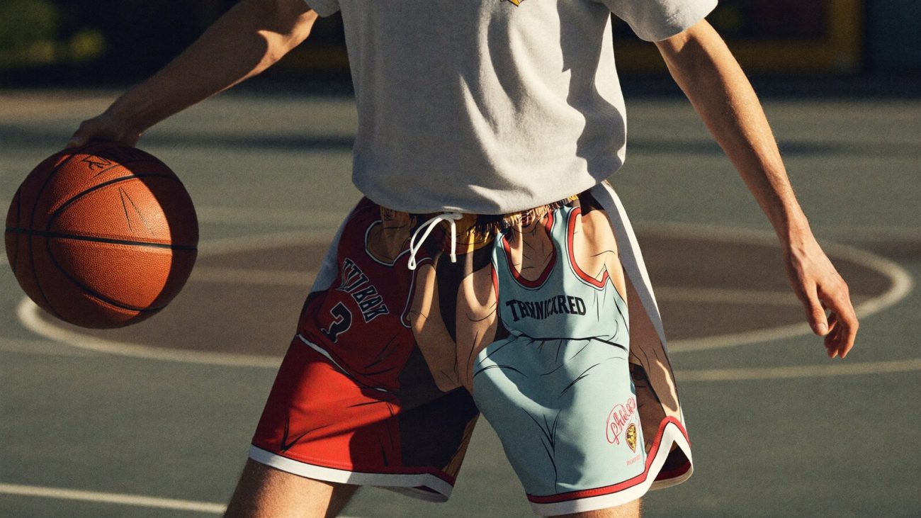 Person wearing an anime-inspired double layer basketball shorts in an editorial scene