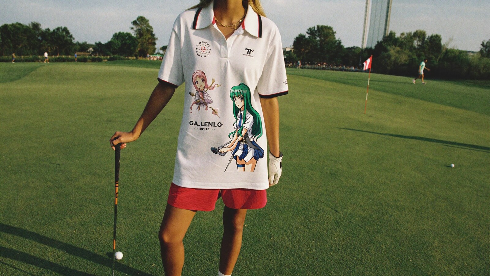 Anime-inspired embroidered polo shirt styled in a natural daylight scene
