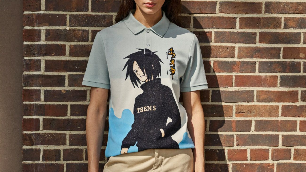 Person wearing an anime-inspired embroidered polo shirt in an editorial scene