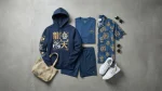 Blue and gold Fate merch streetwear outfit with hoodie, Hawaiian shirt, and sneakers flat-lay