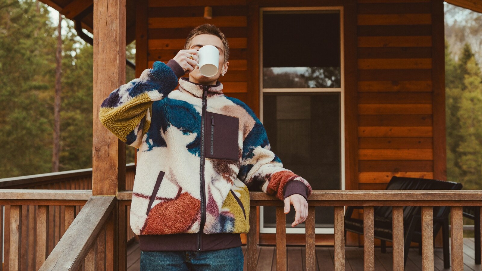 Anime-inspired fleece bomber jacket styled in a natural daylight scene