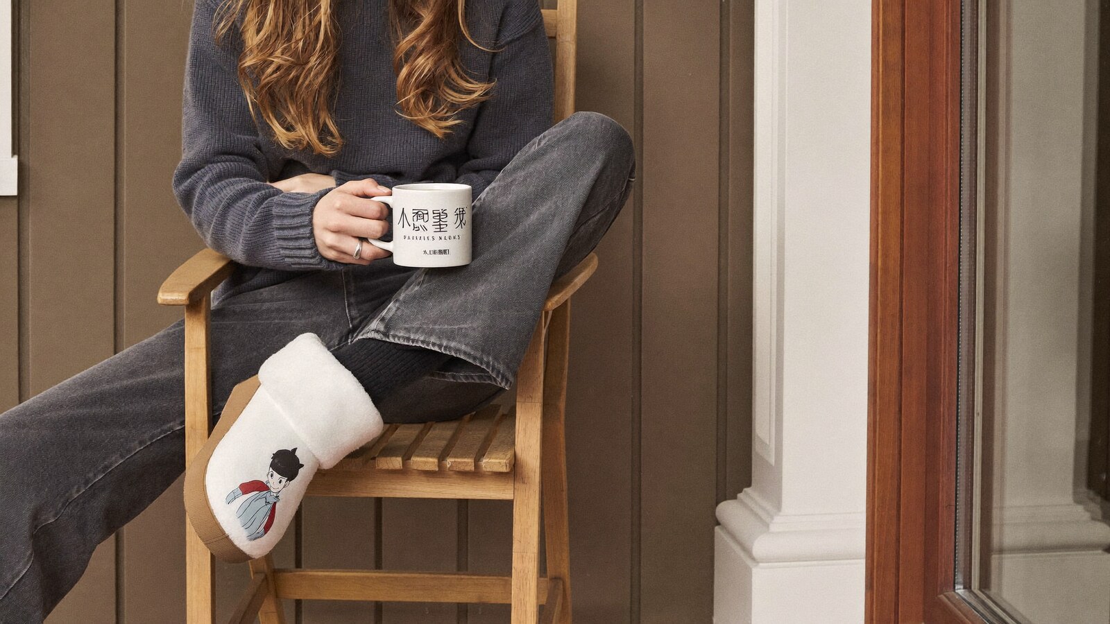 Person wearing an anime-inspired fleece clogs in an editorial scene