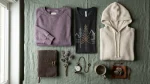 Frieren: Beyond Journey's End merch flat lay with vintage sweatshirt, tee and hoodie in muted purple and gray