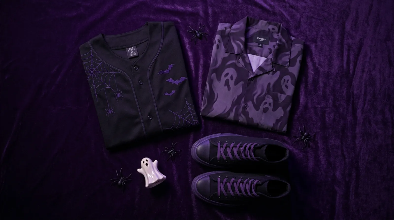 Flat-lay of spooky purple Gengar merch including a baseball jersey, violet Hawaiian shirt and dark high-tops