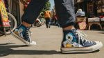 Person wearing an anime-inspired high top canvas shoes in an editorial scene