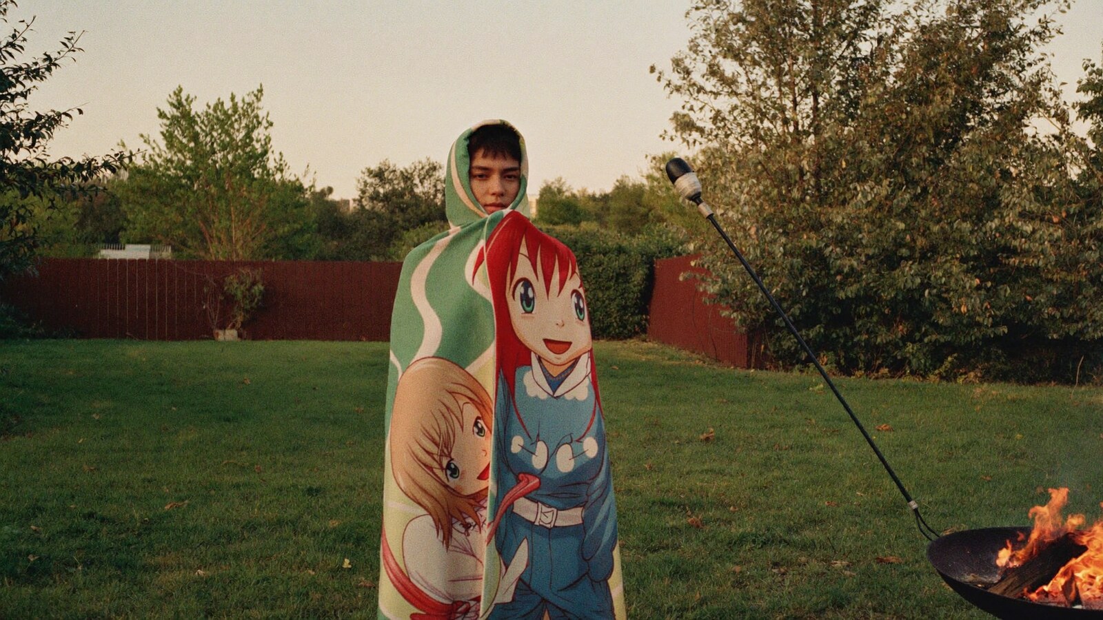 Anime-inspired hooded blankets styled in a natural daylight scene