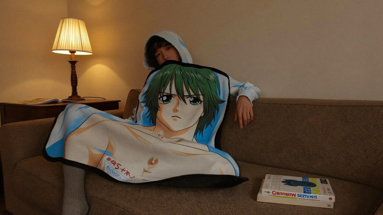 Anime-inspired hooded blankets styled in a cinematic scene