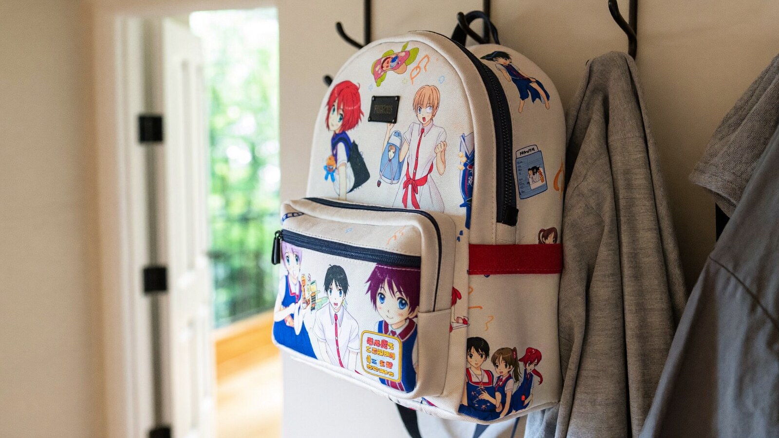 Anime-inspired kids school backpacks styled in a natural daylight scene