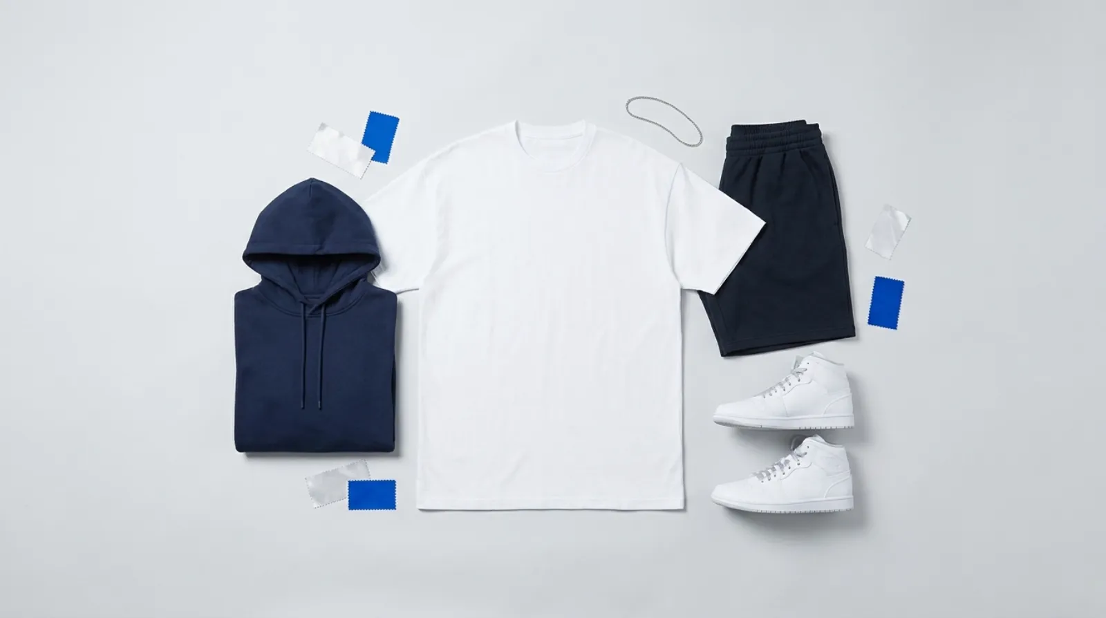 Flat-lay of cool blue and white blank streetwear apparel for a Killua Zoldyck merch lineup