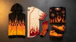 Flat-lay of Kyojuro Rengoku merch including flame haori zip hoodie, baseball jersey, socks, and basketball shoes
