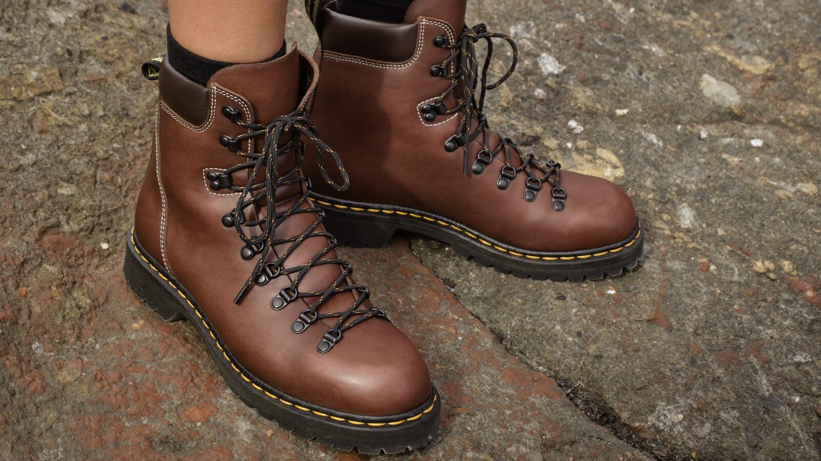 Anime-inspired leather mountain boots styled in a natural daylight scene