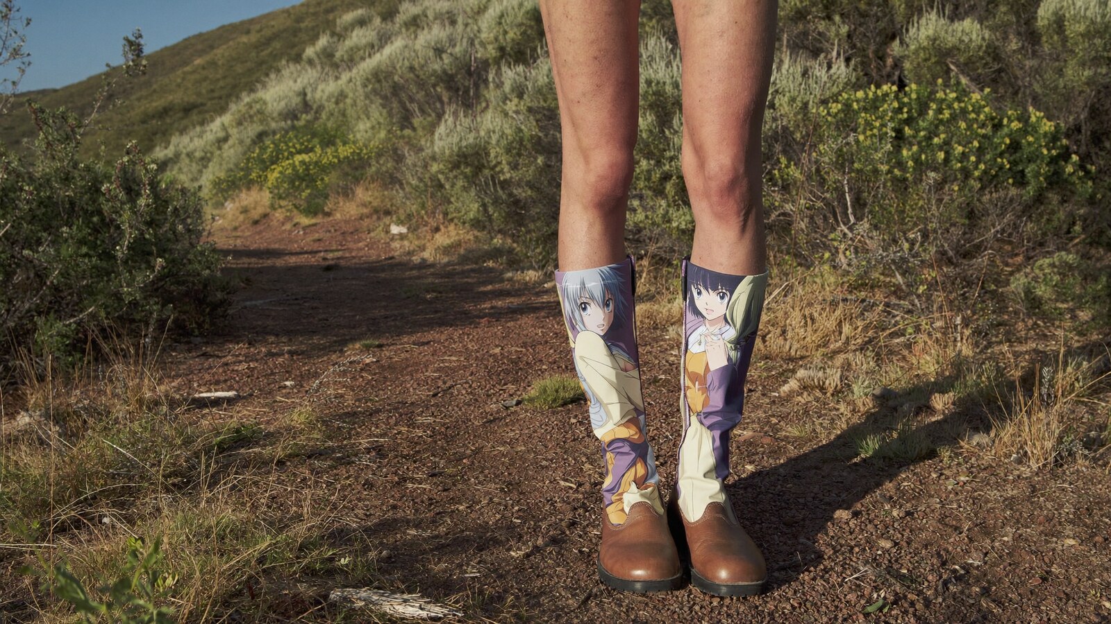 Person wearing an anime-inspired leather mountain boots in an editorial scene