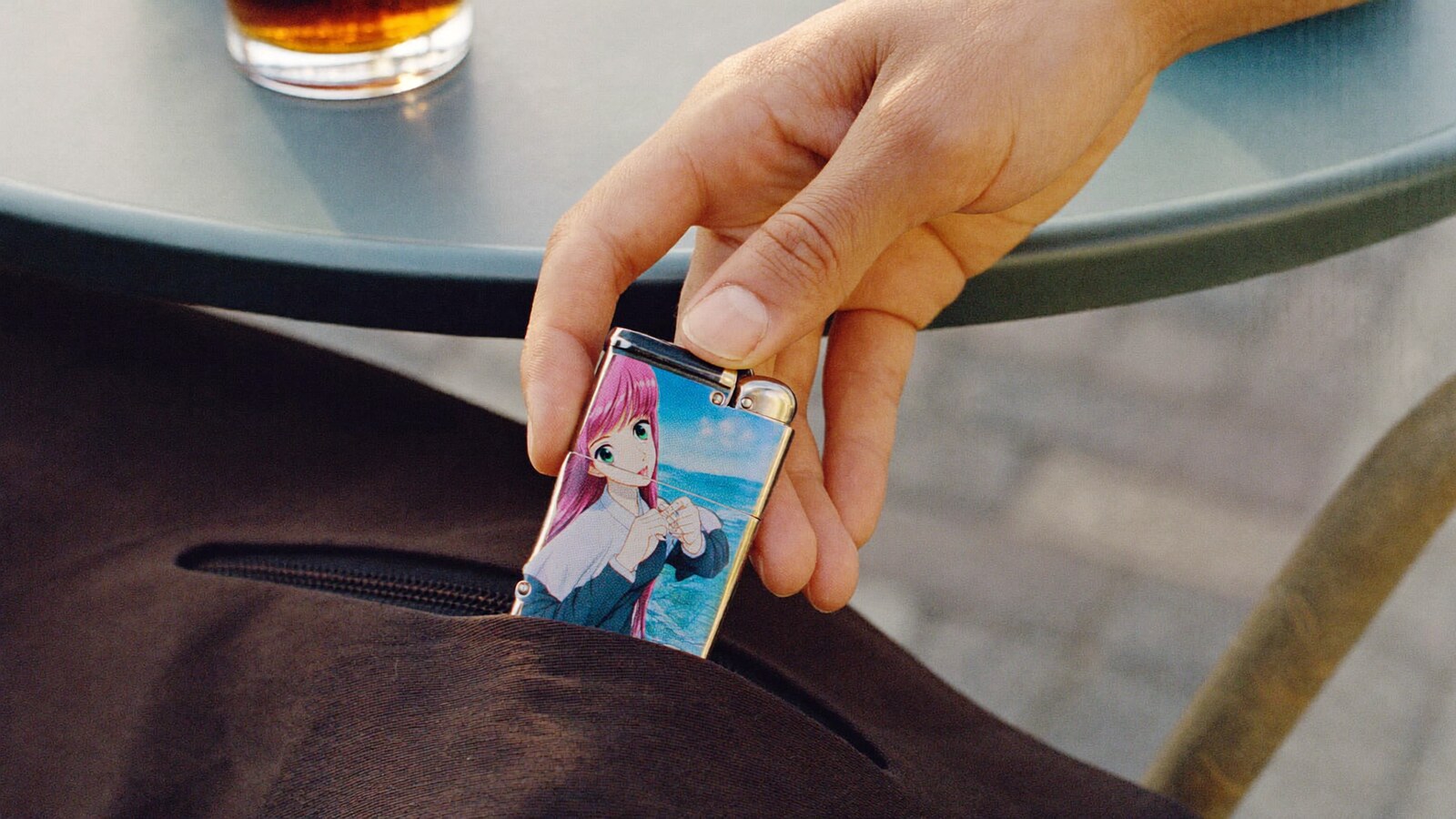 Anime-inspired lighter cases styled in a natural daylight scene