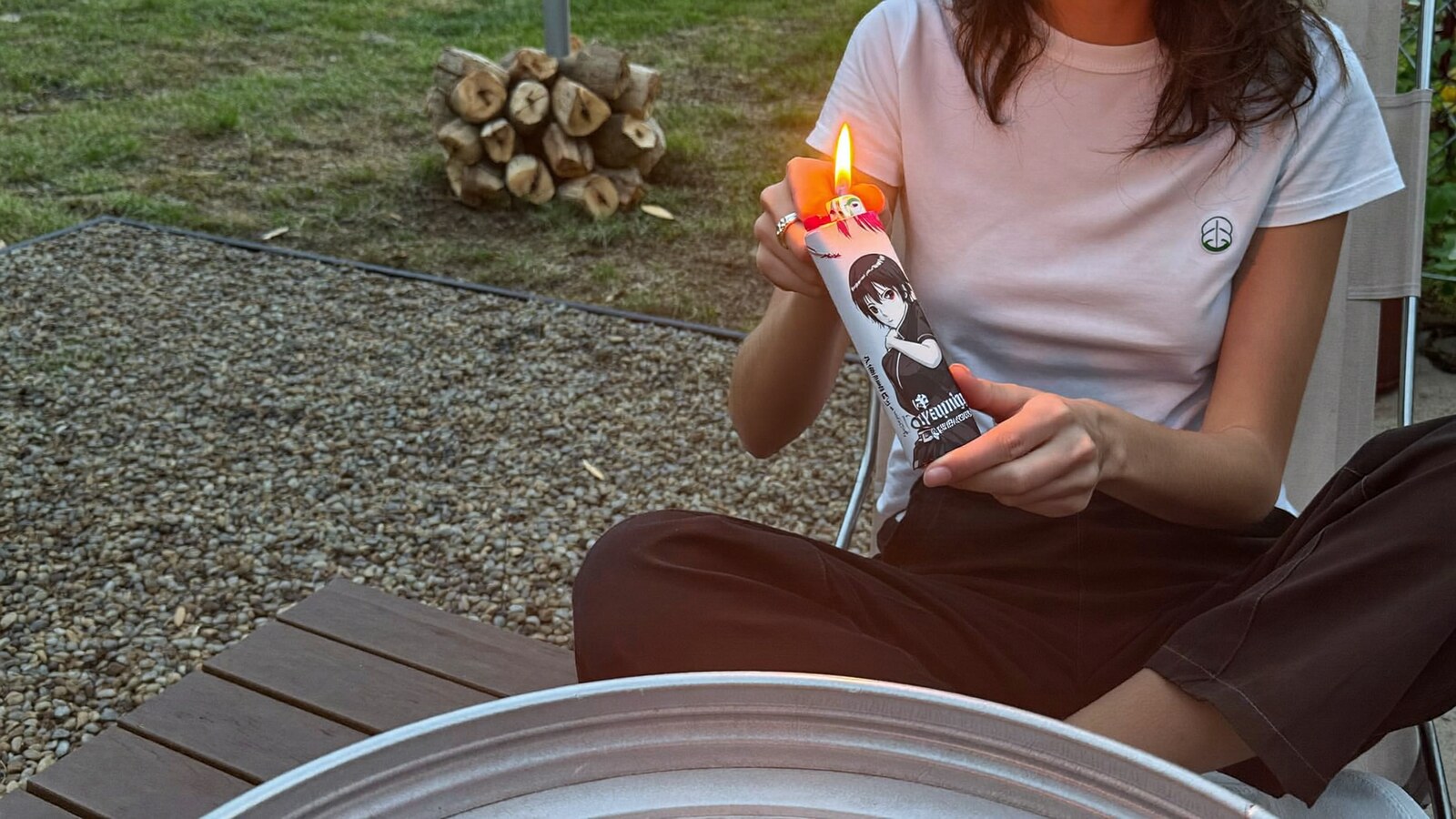 Anime-inspired lighter cases in a social or layered scene with friends