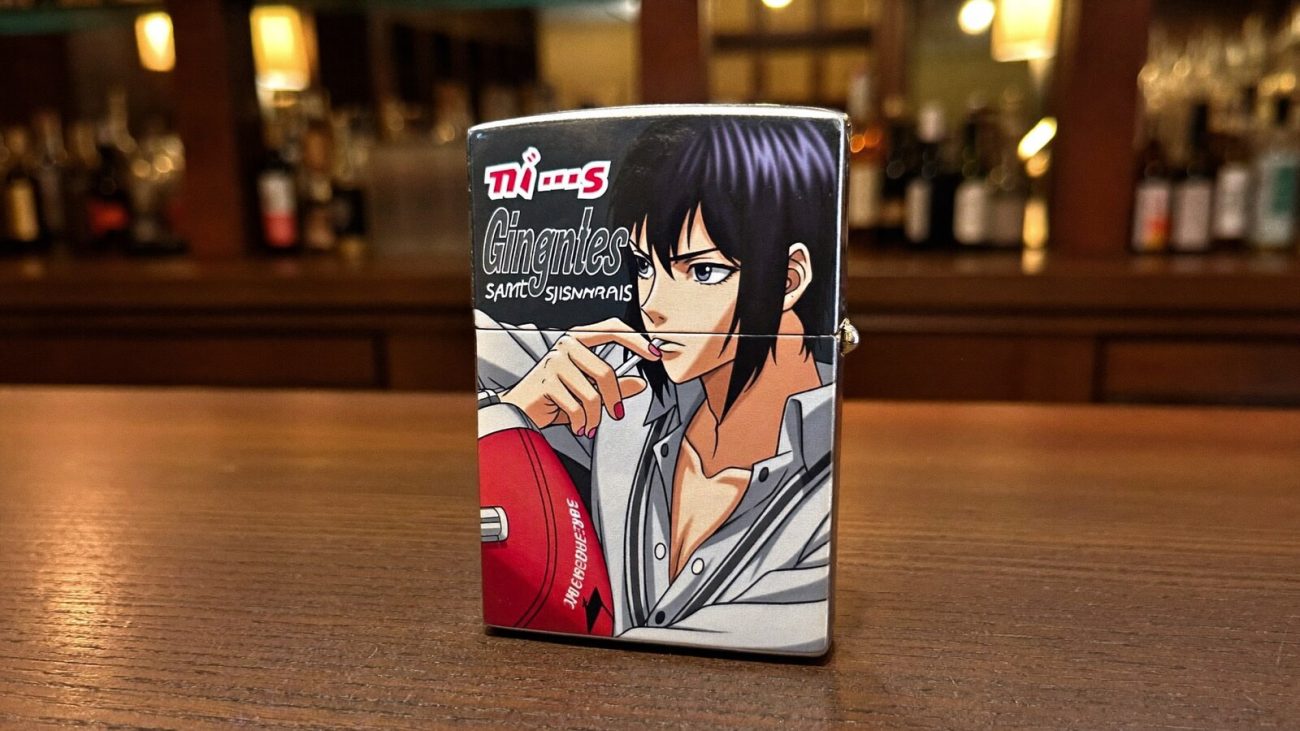 Person wearing an anime-inspired lighter cases in an editorial scene