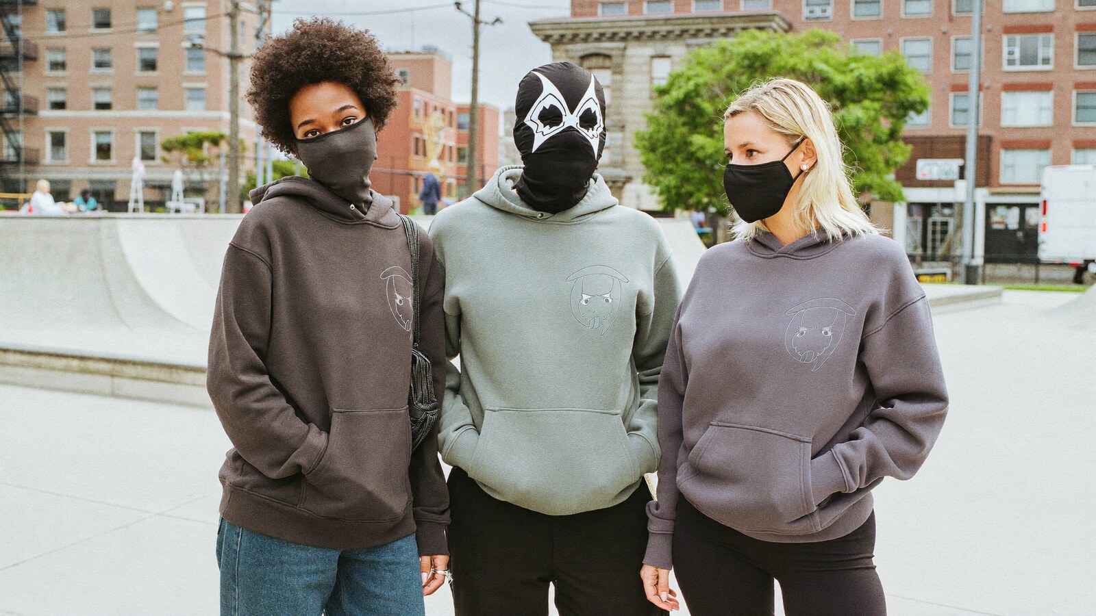 Anime-inspired masked hoodie in a social or layered scene with friends