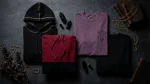 Overlord merch apparel flat lay in black and gold dark fantasy streetwear hoodies and tee