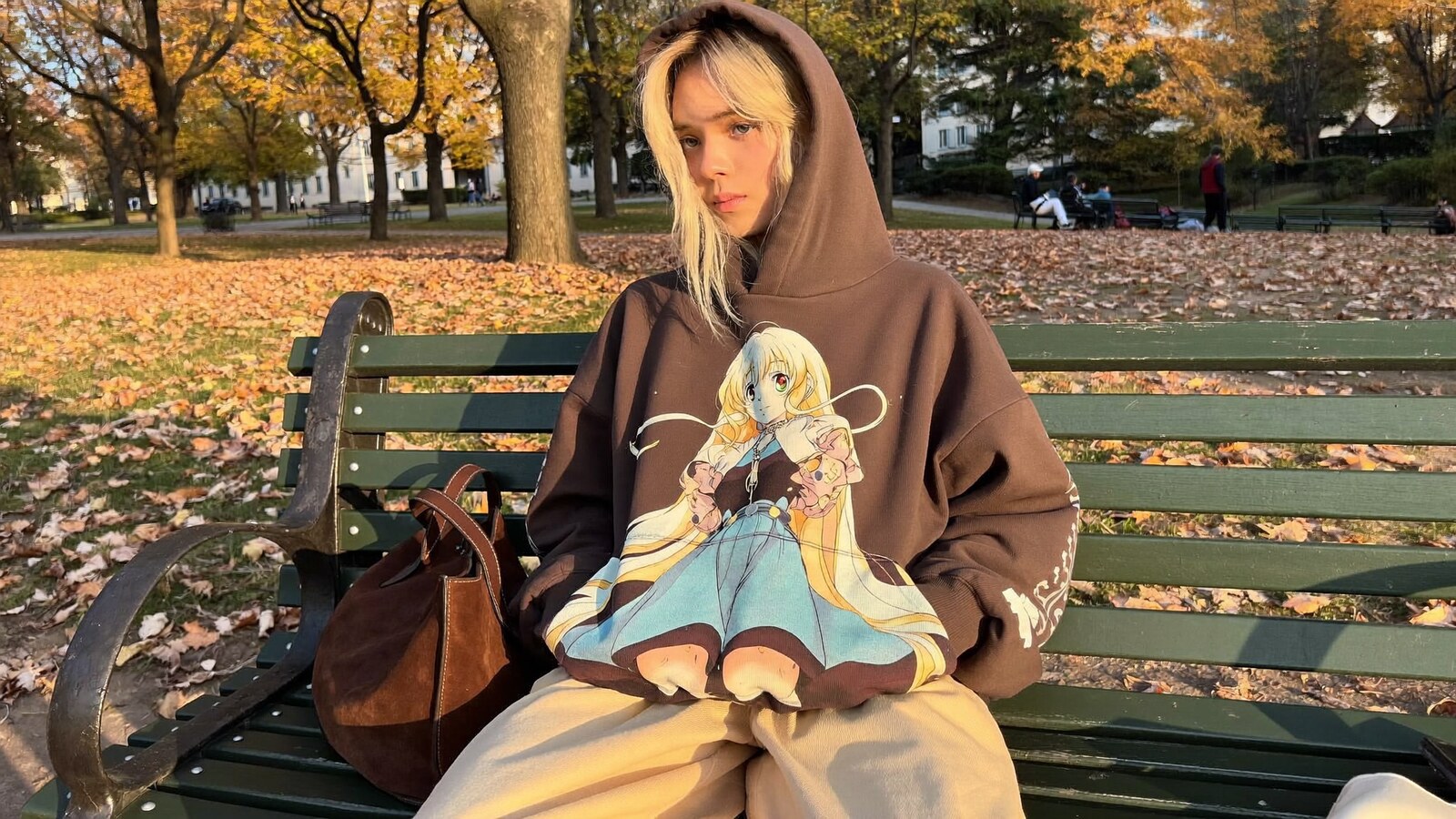 Anime-inspired oversized hoodies styled in a natural daylight scene