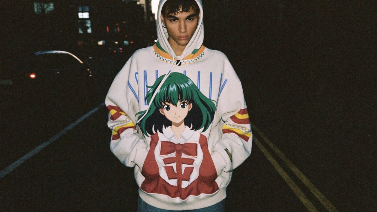 Person wearing an anime-inspired oversized hoodies in an editorial scene