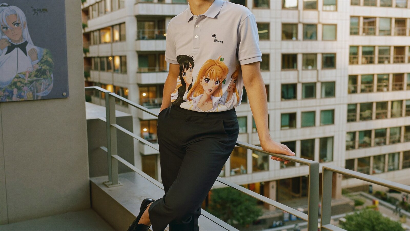 Person wearing an anime-inspired polo shirts in an editorial scene