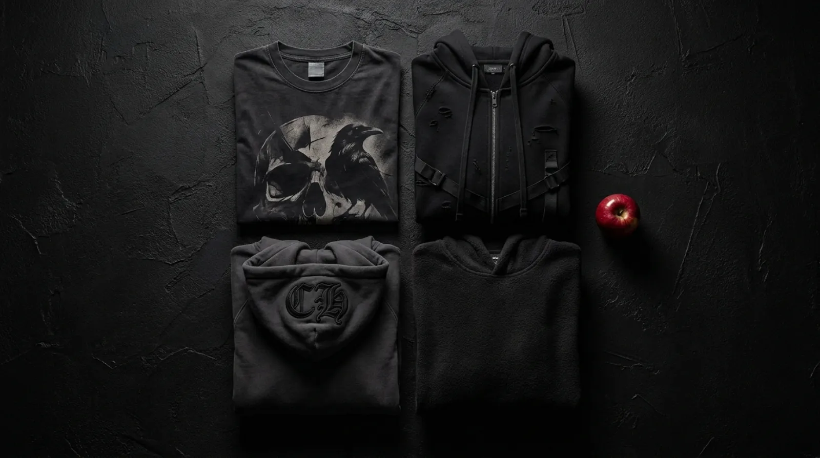 Ryuk shirt and hoodie flat lay in black with a single red apple accent