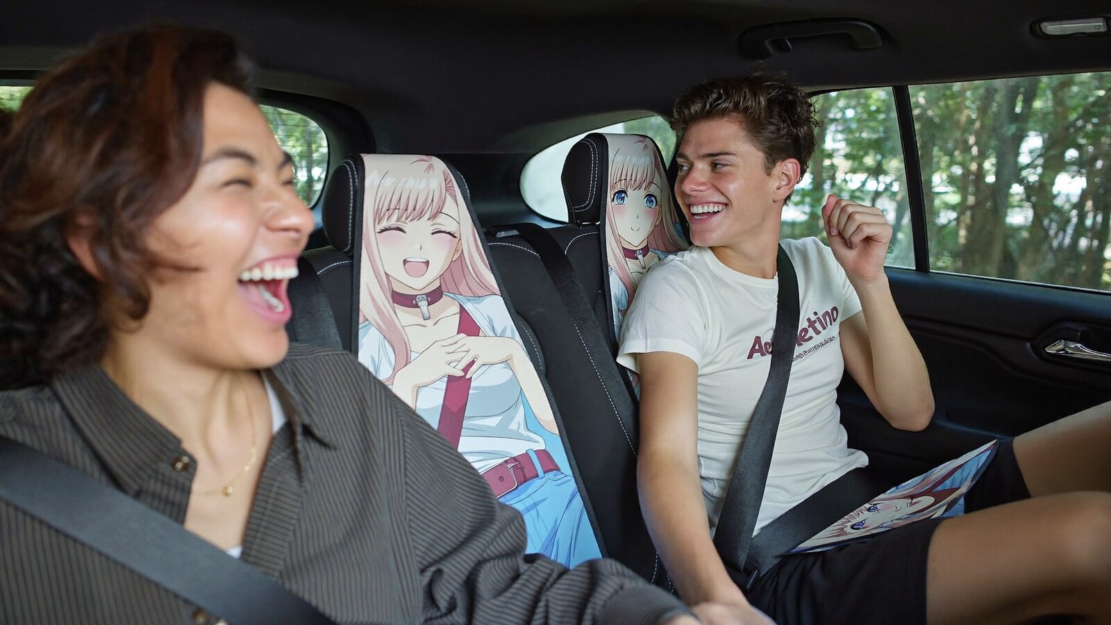 Anime-inspired car seat belt covers in a social or layered scene with friends