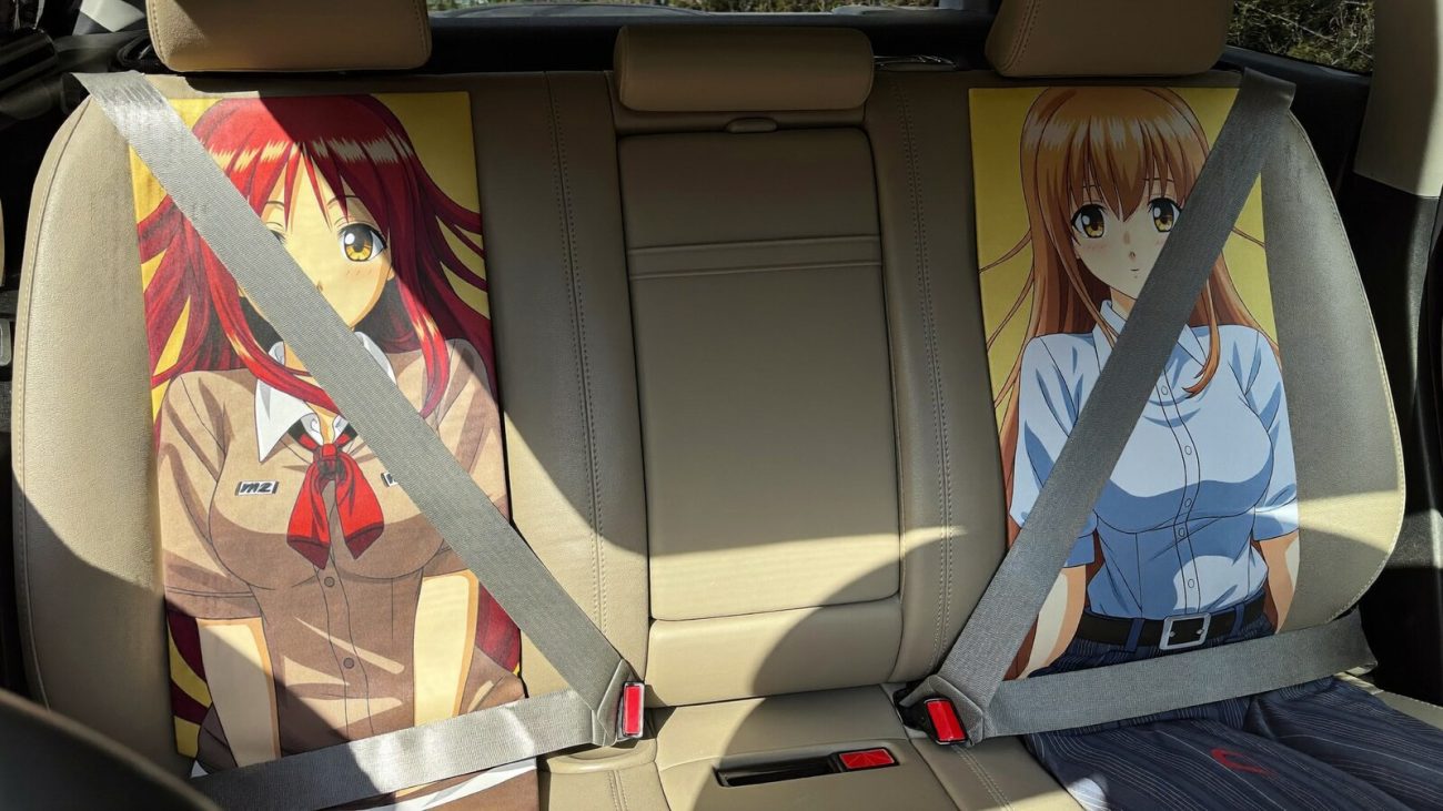 Anime-inspired car seat belt covers styled in a cinematic scene