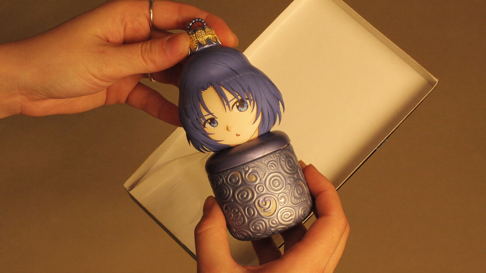 Anime-inspired shaker ornaments in a social or layered scene with friends