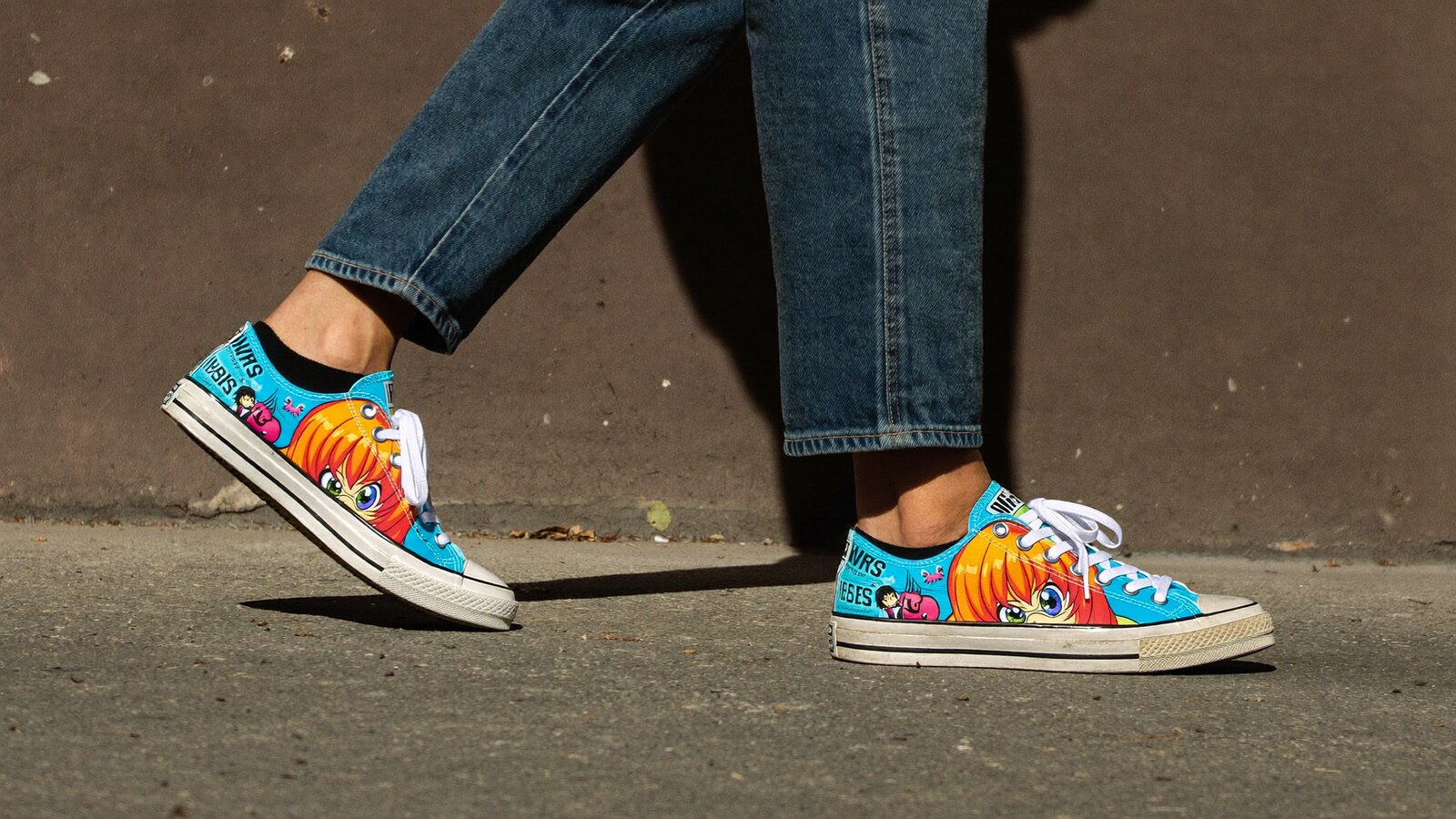 Person wearing an anime-inspired shoes in an editorial scene