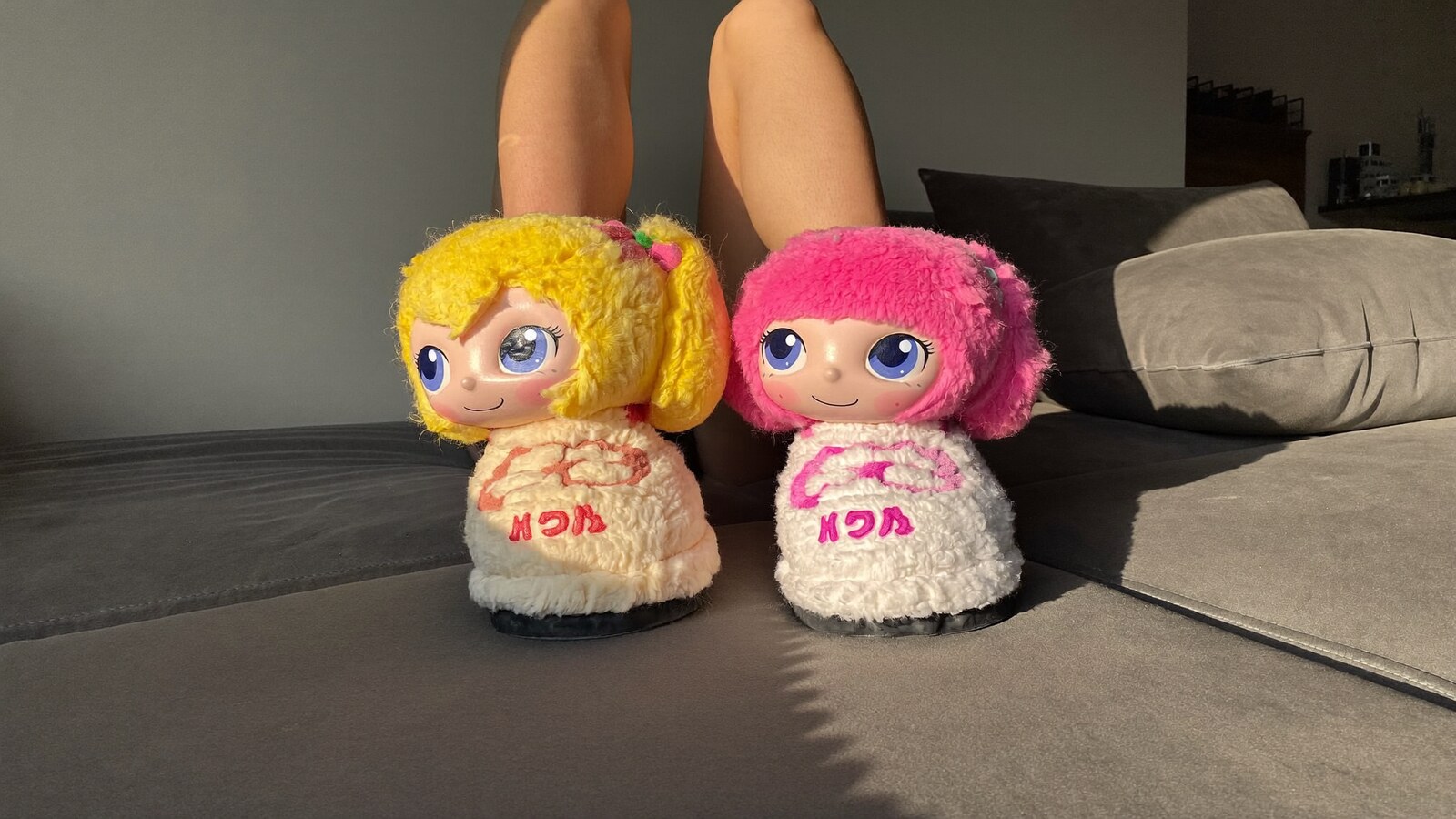 Person wearing an anime-inspired slippers in an editorial scene