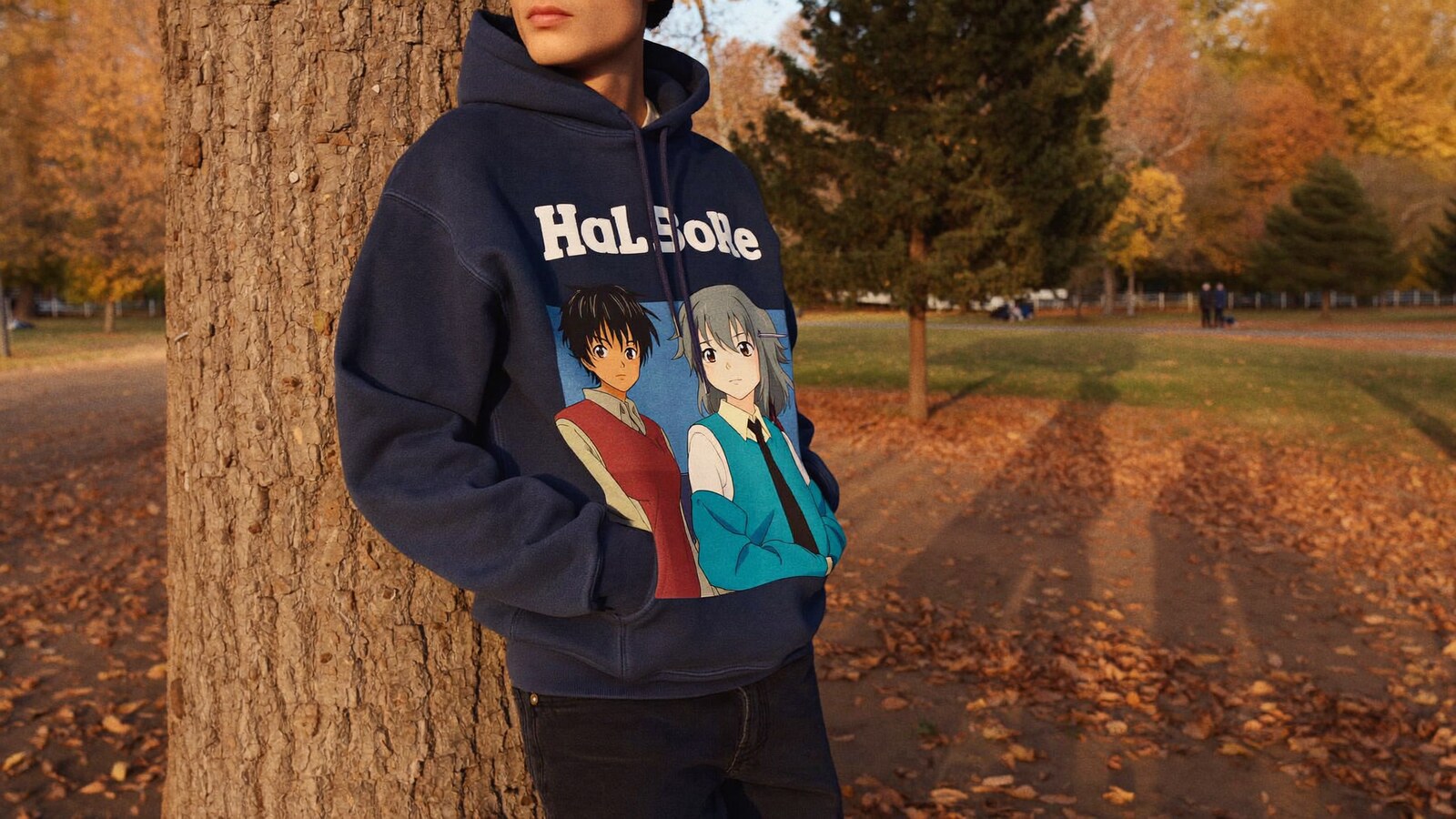 Anime-inspired streetwear hoodies styled in a natural daylight scene