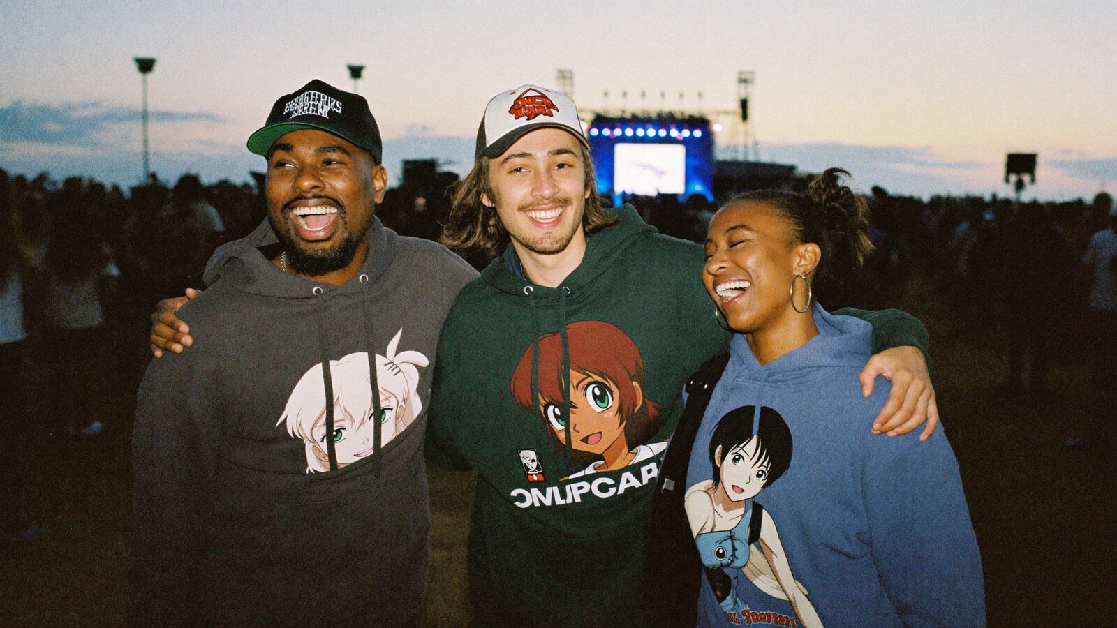 Anime-inspired streetwear hoodies in a social or layered scene with friends