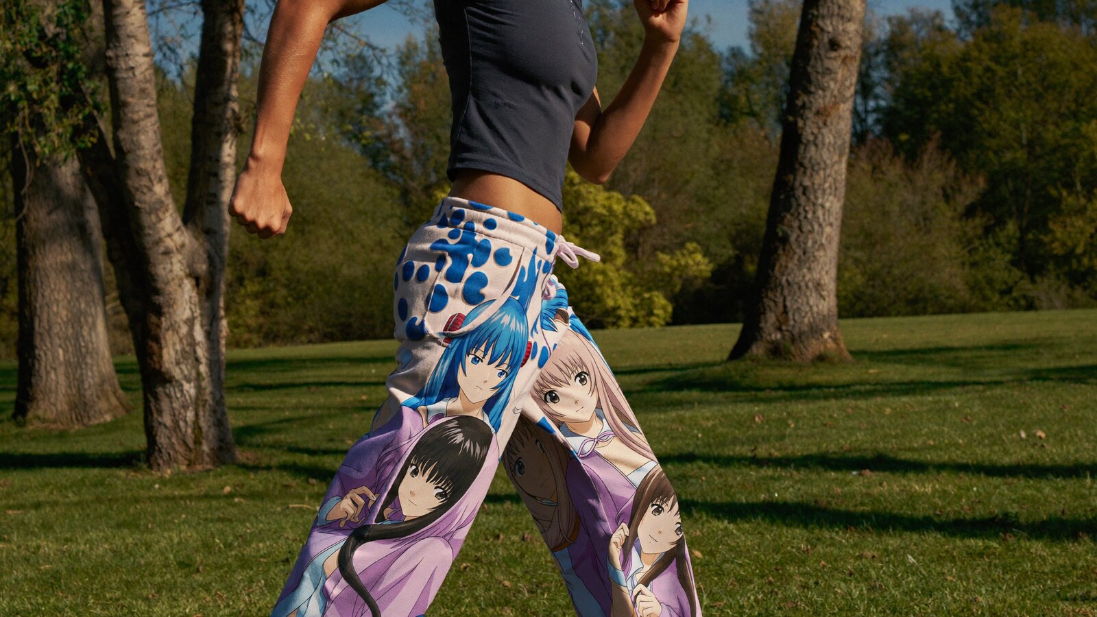 Anime-inspired streetwear sweatpants styled in a natural daylight scene