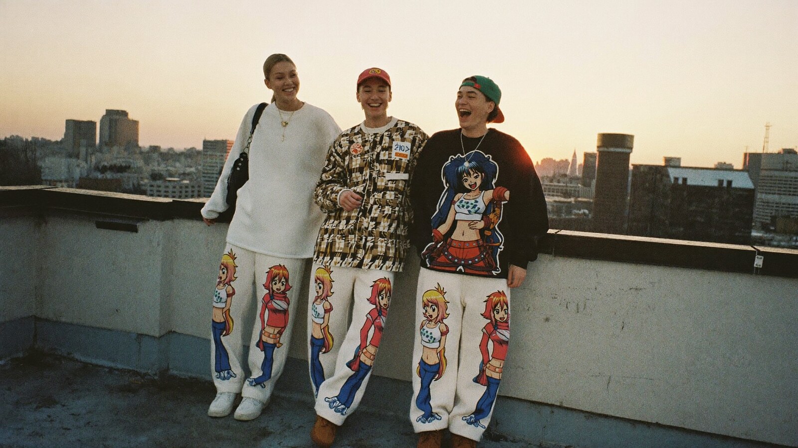 Anime-inspired streetwear sweatpants in a social or layered scene with friends