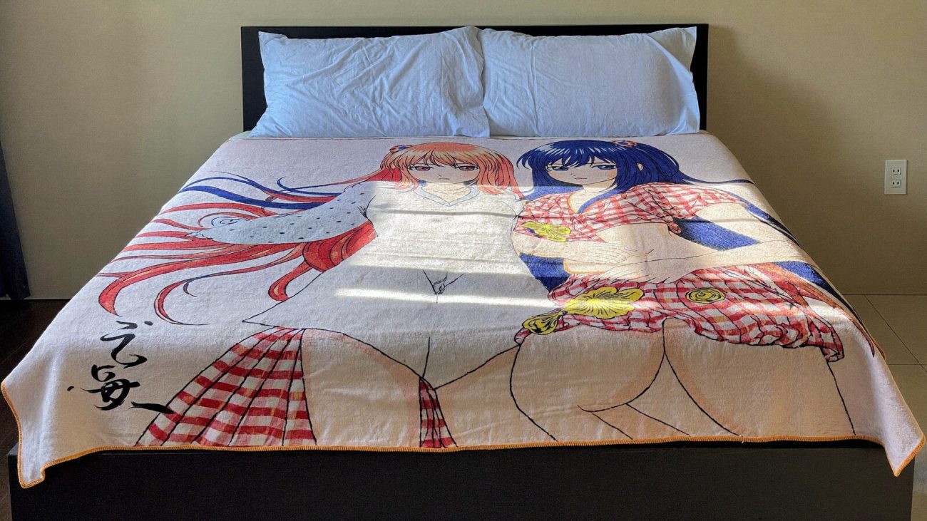 Anime-inspired tapestry blanket bedspread styled in a cinematic scene