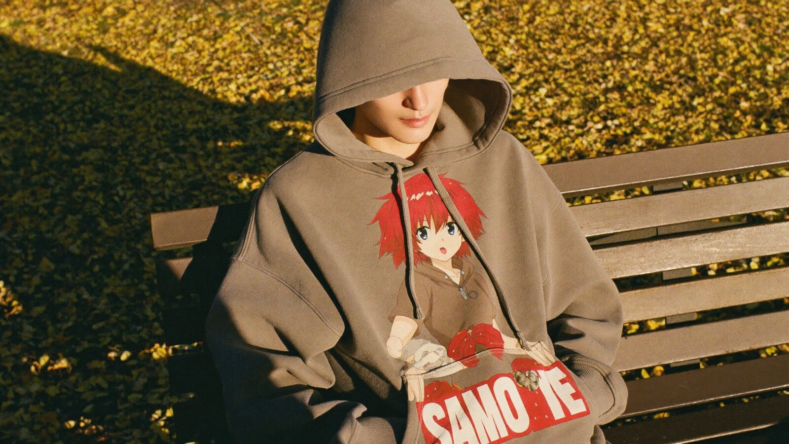 Anime-inspired vintage hoodie styled in a natural daylight scene