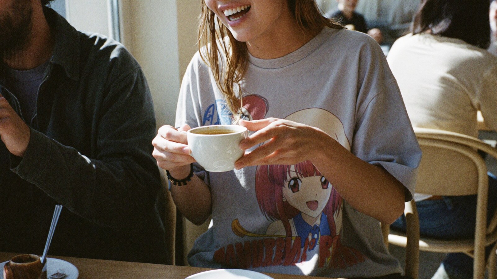 Anime-inspired vintage t-shirts styled in a natural daylight scene